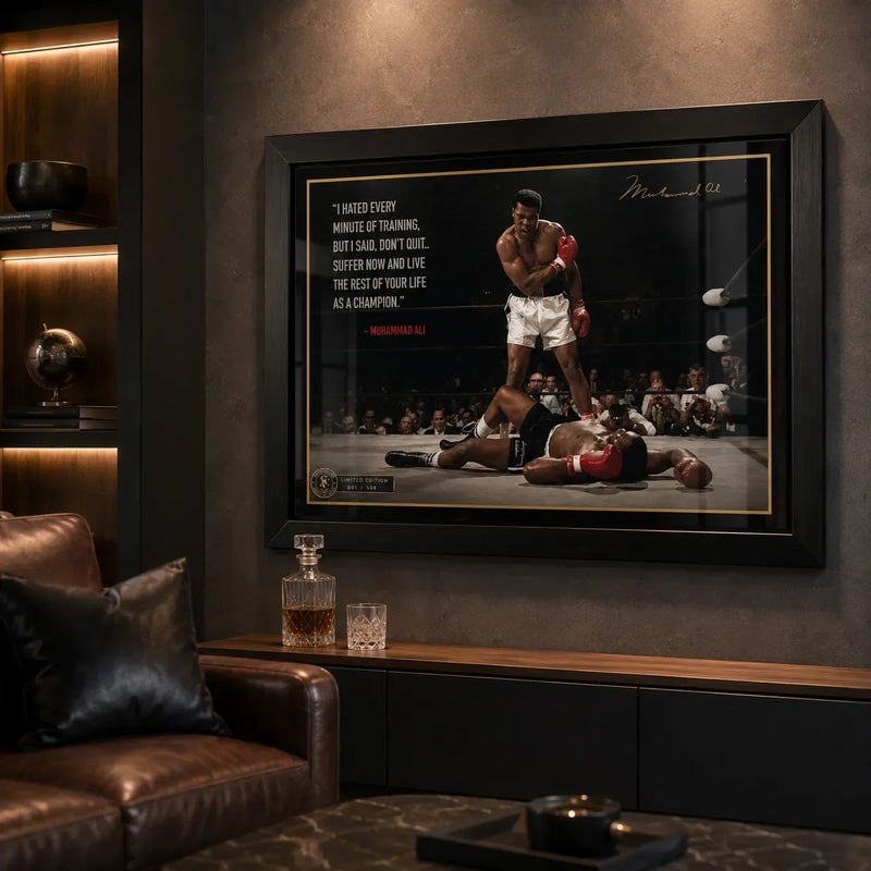 Muhammad Ali framed sports wall art displayed in a dark premium man cave with leather seating and warm feature lighting.