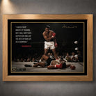 Muhammad Ali Live Like a Champion wall art in an oak frame, featuring the iconic knockout scene and motivational quote.