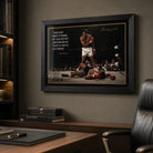 Muhammad Ali framed sports wall art displayed above a timber desk in a refined home office with dark shelving.