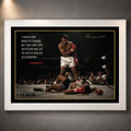 Muhammad Ali Live Like a Champion wall art in a white frame, featuring the iconic knockout scene and motivational quote.