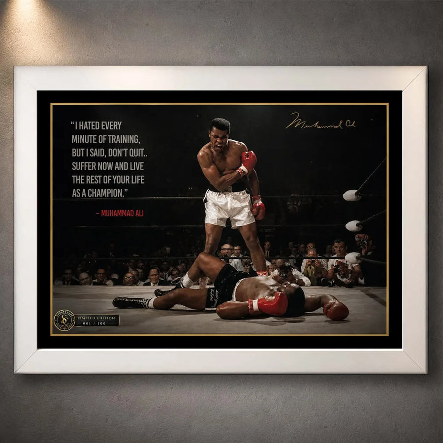 Muhammad Ali Live Like a Champion wall art in a white frame, featuring the iconic knockout scene and motivational quote.