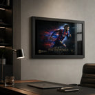 Black framed Neymar Jr Barcelona wall art displayed in a modern office above a desk with soft window reflections.