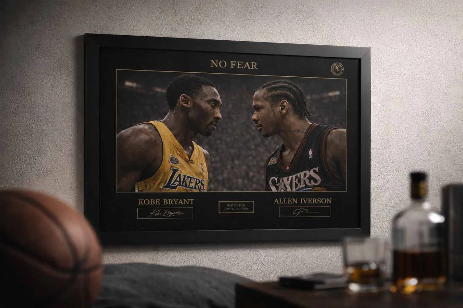 Black framed man cave wall décor showing Kobe Bryant vs Allen Iverson No Fear artwork styled in a modern sports lounge setting.