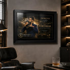Novak Djokovic framed tennis wall art hanging in a dark man cave lounge with leather chair and collector room feel.