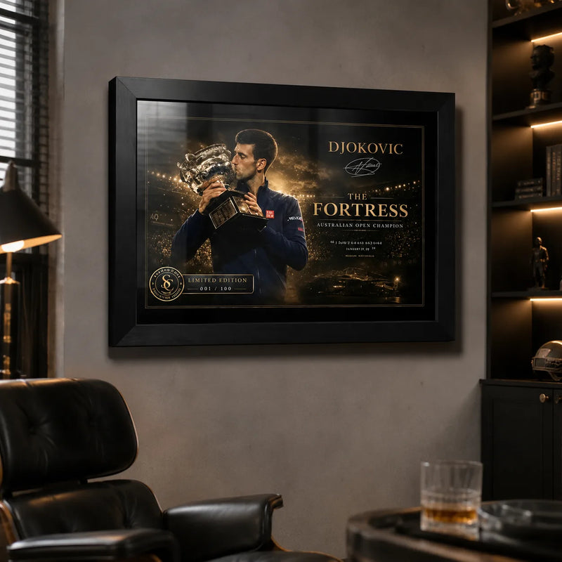 Novak Djokovic framed tennis wall art hanging in a dark man cave lounge with leather chair and collector room feel.