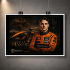 Unframed motorsport wall art print on a grey wall with orange racing artwork.