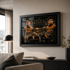 Papaya Pressure Piastri vs Norris wall art displayed in a modern living room above a dark console.