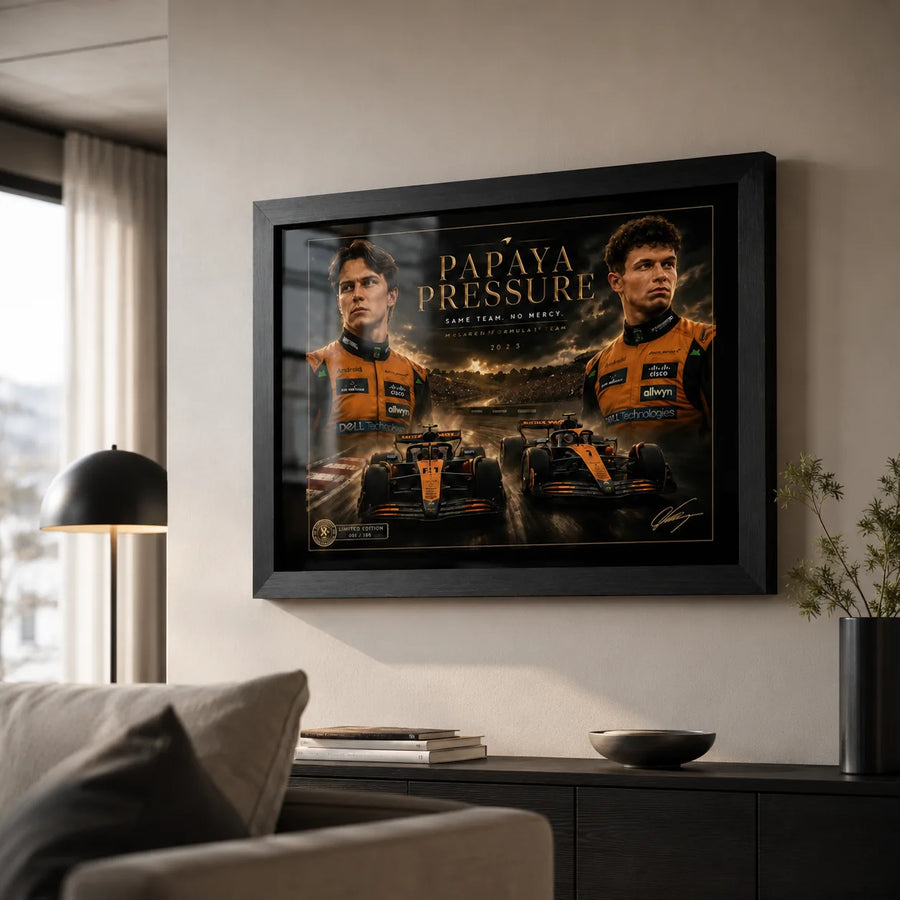 Papaya Pressure Piastri vs Norris wall art displayed in a modern living room above a dark console.