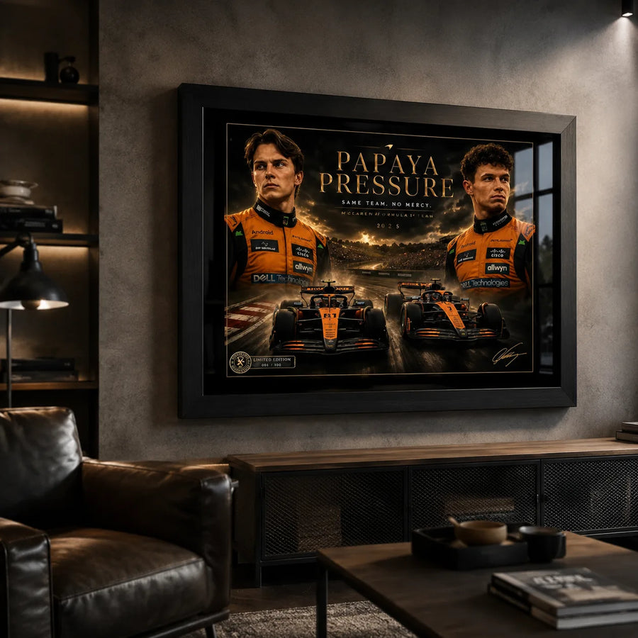 Black framed Piastri vs Norris motorsport wall art displayed in a dark man cave with leather seating.