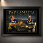 Black framed Parramatta Glory Years wall art featuring Peter Sterling and Brett Kenny in blue and gold.