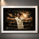 Pat Cummins The Captain’s Roar cricket wall art shown in a clean white frame against a textured grey wall.