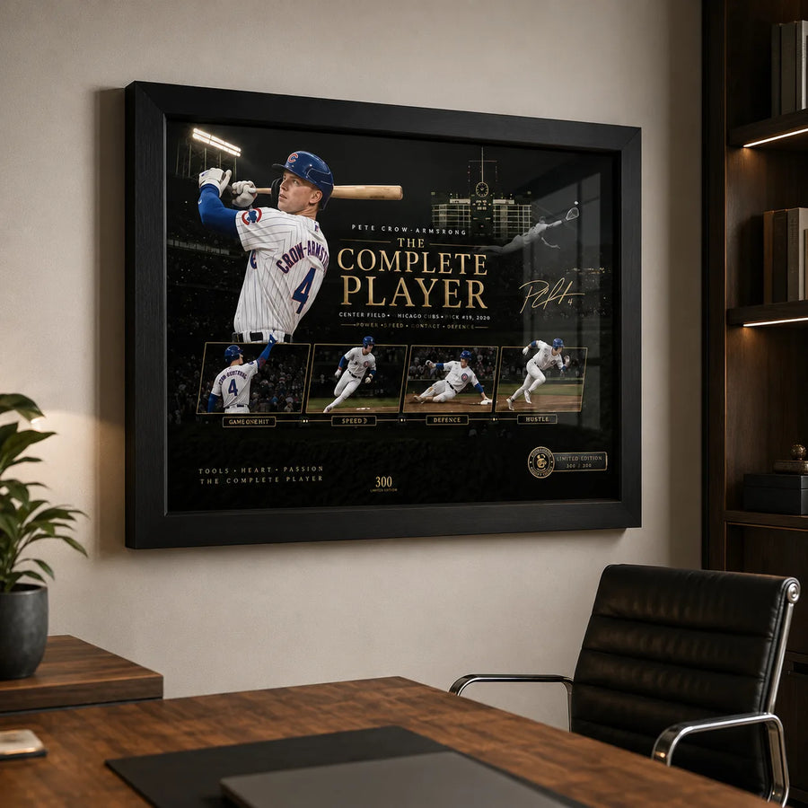 Pete Crow-Armstrong wall art in a modern office, shown in a black frame above a timber desk and leather chair.