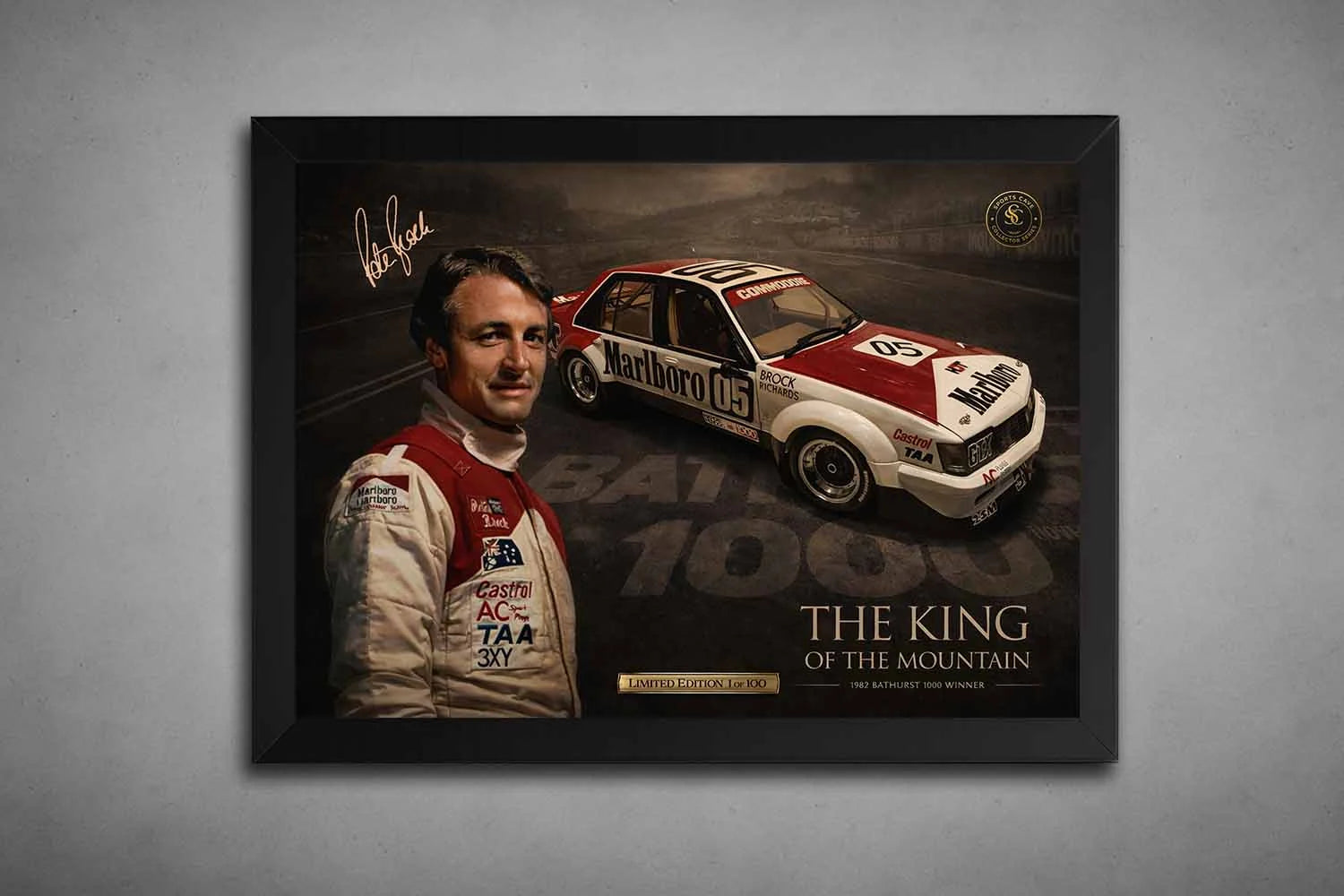 Black-framed Peter Brock Bathurst 1000 Holden Commodore poster, premium sports collectibles shown on grey wall.