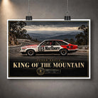 Unframed Peter Brock King of the Mountain wall art displayed with clips, featuring the number 05 racing car.