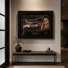 Peter Brock limited edition motorsport wall art displayed in a premium living room with black framed sports art.