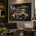 Peter Brock wall art displayed above a desk in a modern office, styled in a black frame for a motorsport collector space.