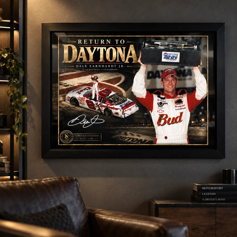 Dale Earnhardt Jr. Return to Daytona wall art displayed in a dark motorsport man cave with black framing.