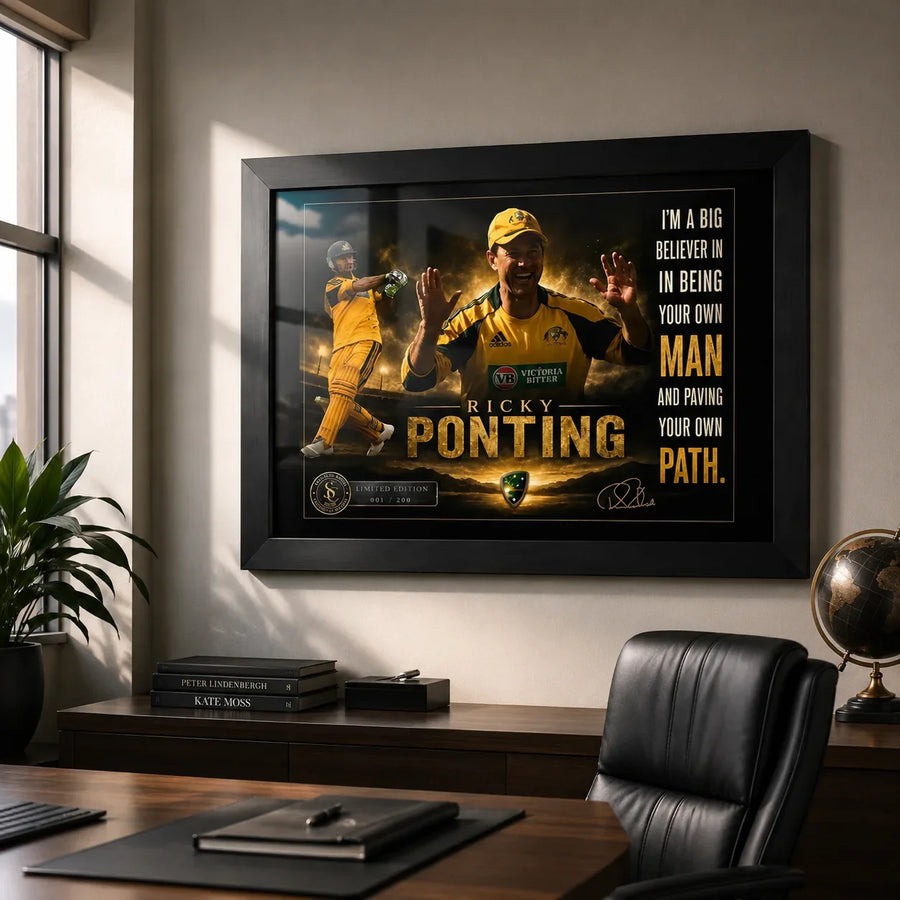 Ricky Ponting framed cricket wall art displayed above a timber desk in a refined office with soft natural window light.