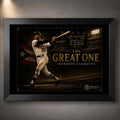 Roberto Clemente The Great One baseball wall art shown in a premium black frame against a softly lit concrete wall.