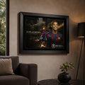 Framed Ronaldinho soccer wall art displayed on a living room wall above a sofa with warm interior lighting.