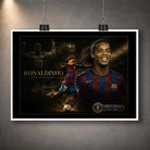 Unframed Ronaldinho art print hanging with clips, showing the football legend in a dark soccer design.