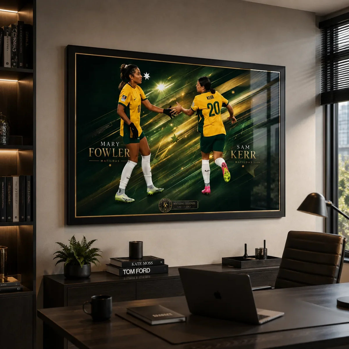 Sam Kerr and Mary Fowler Matildas soccer wall art in a black frame displayed above a modern office desk.