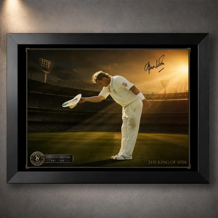 Black framed Shane Warne cricket wall art showing his bowing tribute beneath warm stadium light.