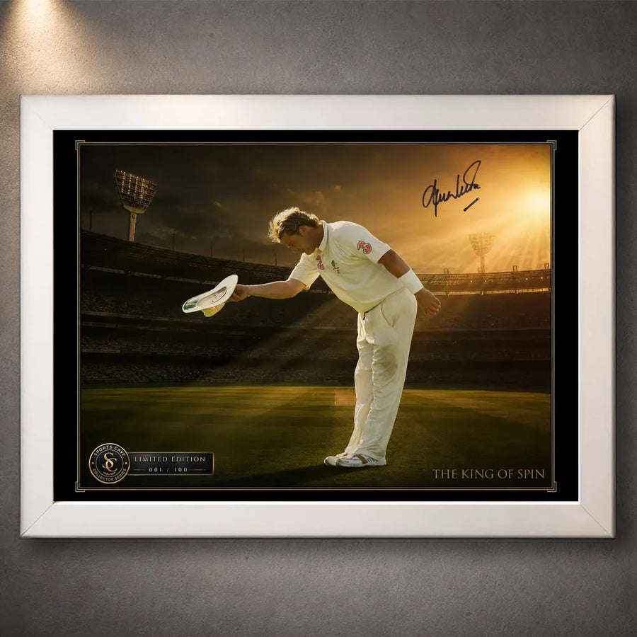 White framed Shane Warne cricket wall art featuring his bowing tribute against a golden stadium backdrop.