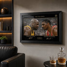 The Collision Shaq vs Hakeem framed sports art in a dark man cave with leather chair and display shelves