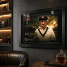 Sir Donald Bradman framed cricket wall art mounted in a dark premium man cave with warm shelf lighting.