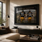 Greene and Lambert NFL wall art displayed in a bright modern living room with a black frame.