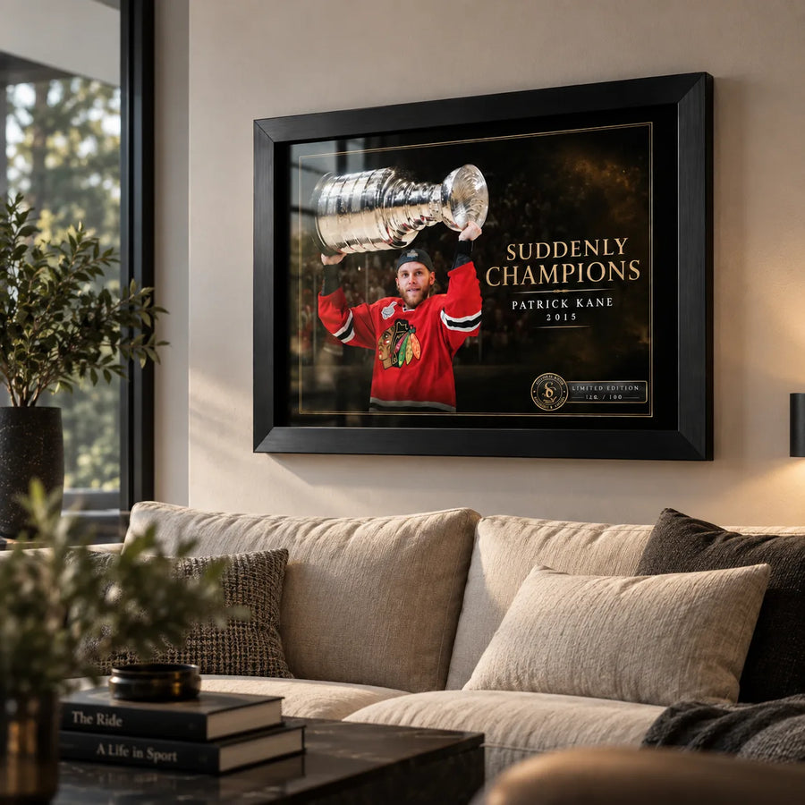 Patrick Kane wall art in a contemporary living room, displayed in a black frame above a neutral sofa near tall windows.