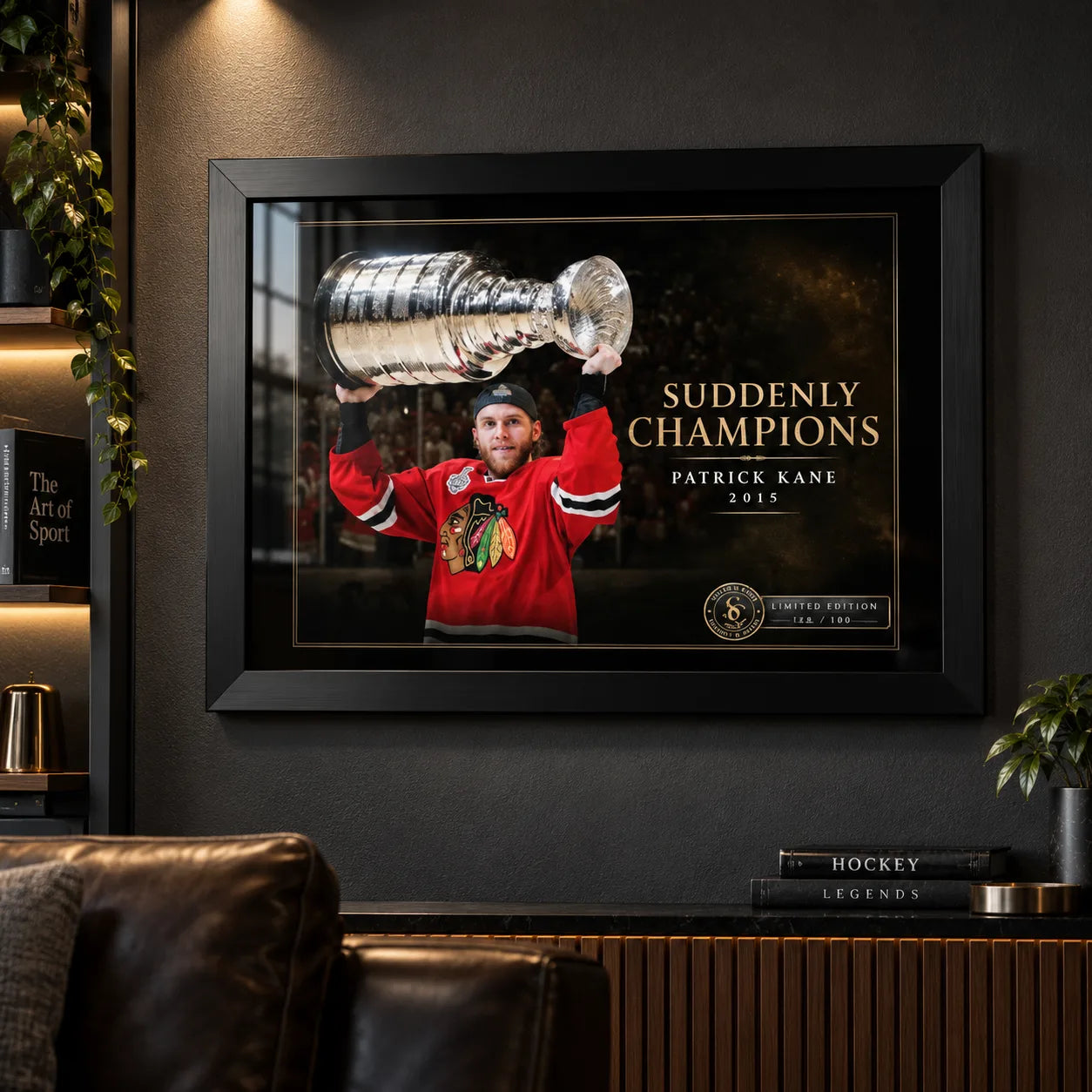Patrick Kane wall art in a dark hockey man cave, displayed in a black frame above leather seating and sports books.