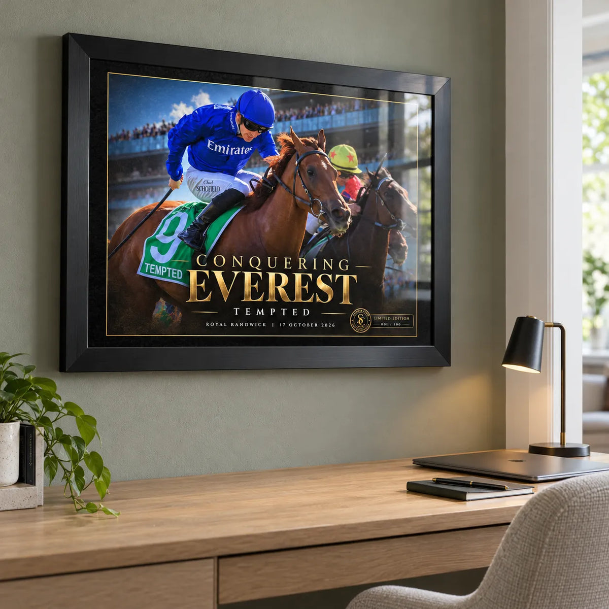 Tempted Conquering Everest black framed horse racing edition above a timber office desk and lamp