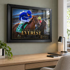 Tempted Conquering Everest black framed horse racing edition above a timber office desk and lamp