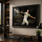 Mitchell Johnson cricket wall art displayed in a home office above a timber desk with dark shelving and warm lighting.