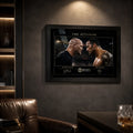 The Attitude Stone Cold vs The Rock framed wall art mounted on a dark feature wall in a premium leather-chair man cave.