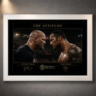 The Attitude Stone Cold vs The Rock wall art in a white frame, featuring their dramatic face-to-face wrestling design.