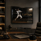Black framed Derek Jeter The Captain baseball wall art mounted in a dark premium office above timber cabinetry.