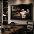 The City Believed NFL wall art displayed in a warm executive office, black framed above a timber credenza and desk.