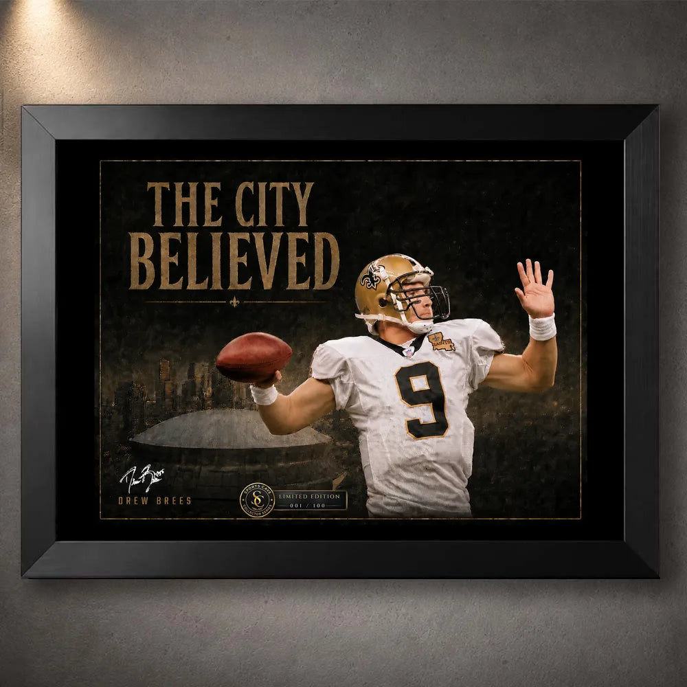 Black framed The City Believed New Orleans NFL wall art featuring a quarterback in white and gold above a dark stadium scene.