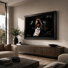 Kawhi Leonard The Claw basketball wall art in a black frame, displayed above a timber console in a modern living room.