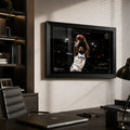 Kawhi Leonard The Claw basketball wall art in a black frame, displayed in a modern office above a dark desk.