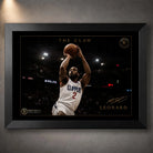 Kawhi Leonard The Claw basketball wall art in a black frame, shown as a close-up product display on a dark grey wall.