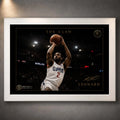 Kawhi Leonard The Claw basketball wall art in a white frame, shown as a close-up product display on a dark grey wall.