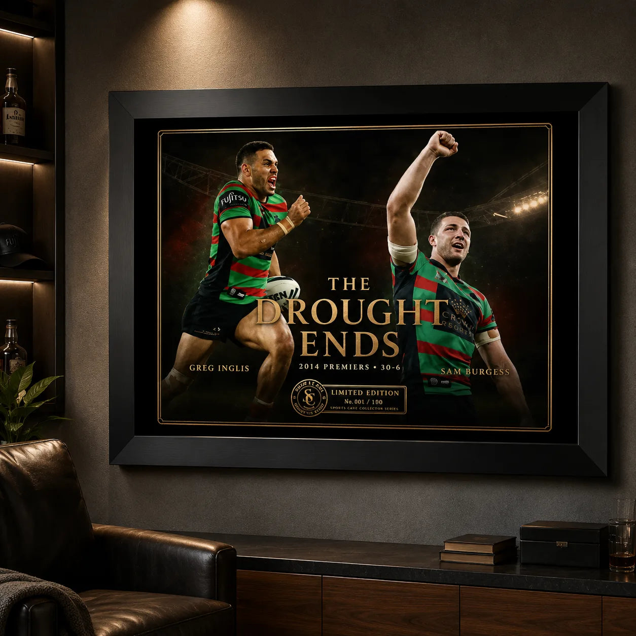 The Drought Ends Greg Inglis and Sam Burgess wall art displayed in a dark man cave with leather seating and warm lighting.