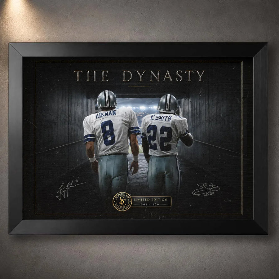 Black framed Aikman and Smith wall art showing the Dallas #8 and #22 figures walking together beneath The Dynasty title.