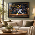 Black framed Jake Bauers wall art displayed above a sofa in a light living room with neutral furnishings.