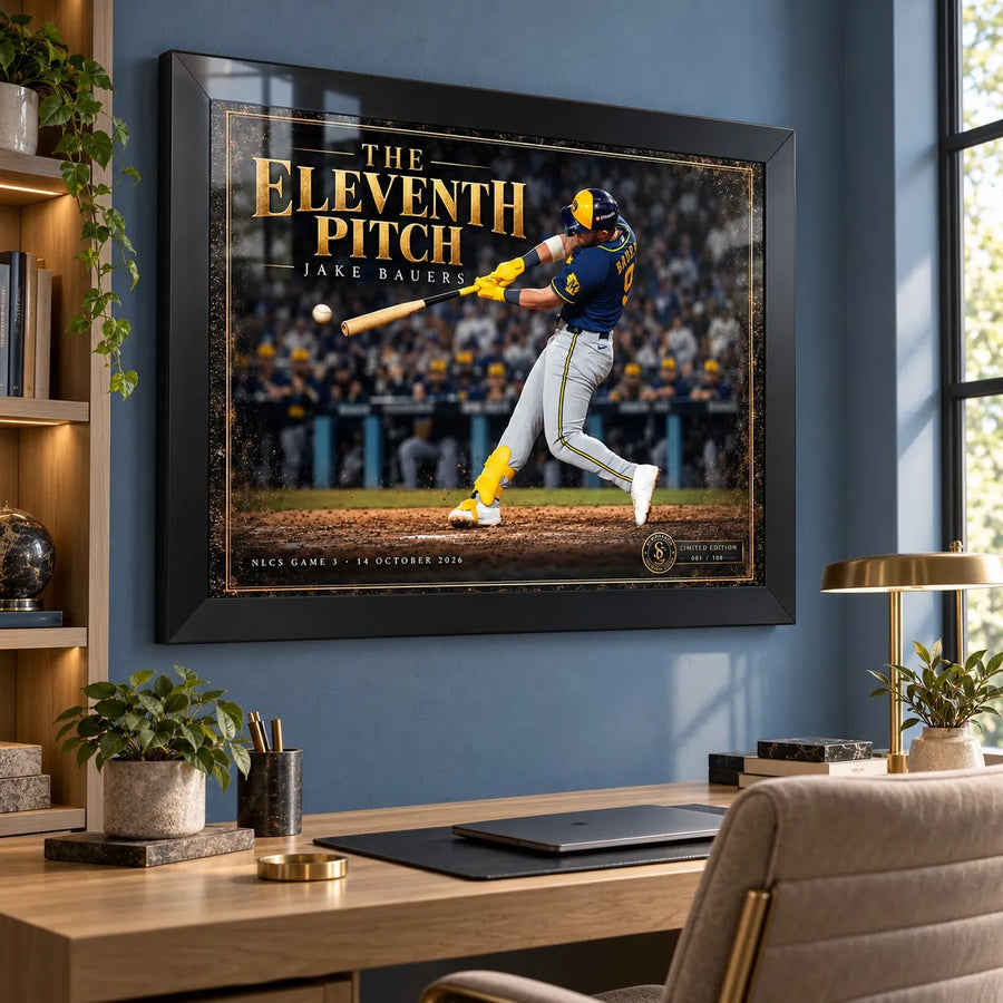 The Eleventh Pitch Jake Bauers wall art in a black frame above a desk in a bright home office.