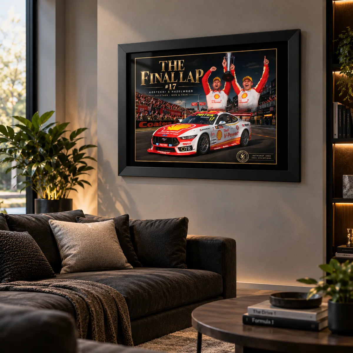 The Final Lap #17 black-framed motorsport wall art above a charcoal sofa in a warm modern living room.